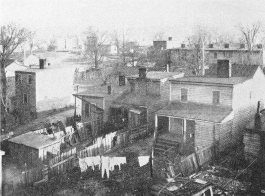"Rear view of Negro homes on Center Street in Fulton, Richmond."  via